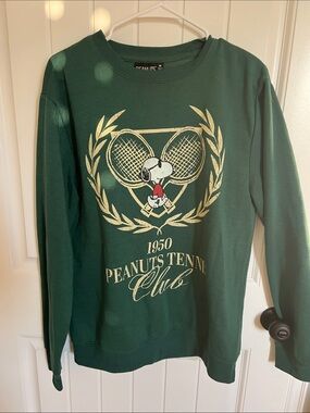 Peanuts Green Crewneck Sweatshirt with Gold Tennis Graphic